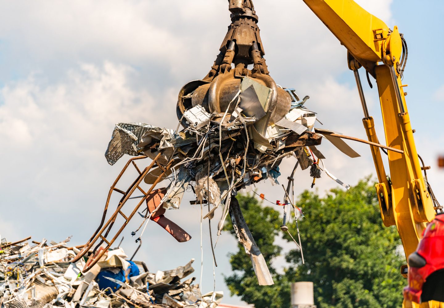 Close-up of a crane for recycling metallic waste on scrapyard